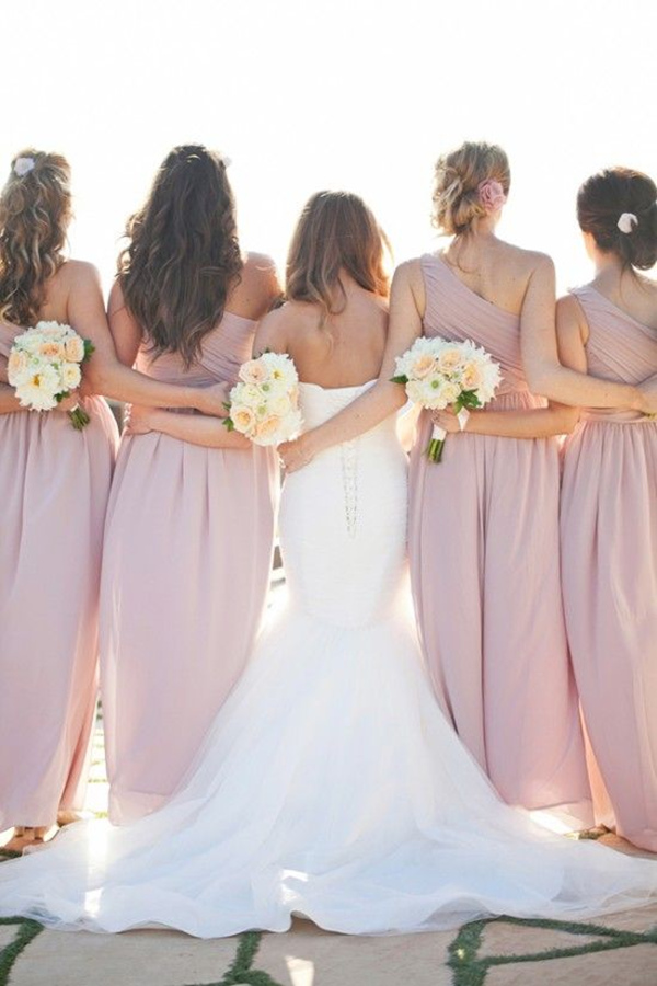 great wedding shot of bride and bridesmaids arm link love
